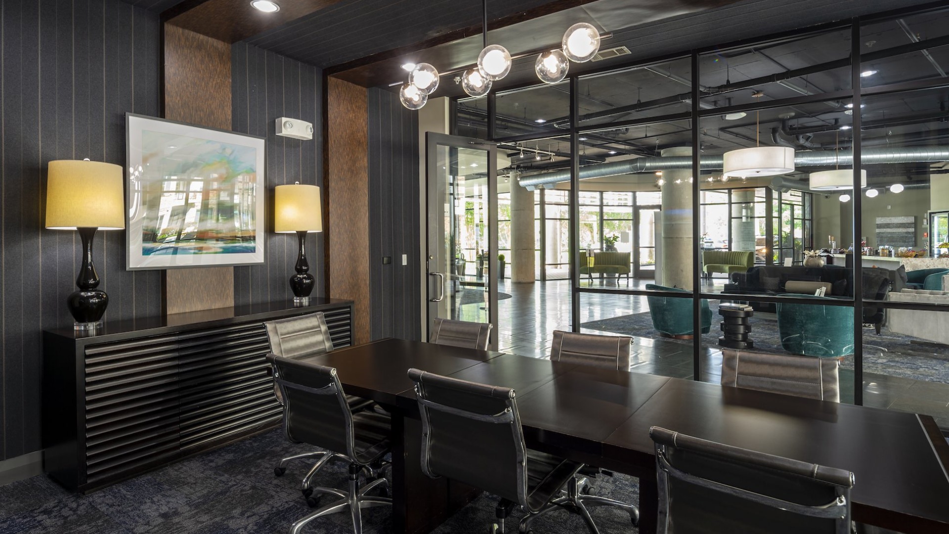 conference room with seating table and large windows